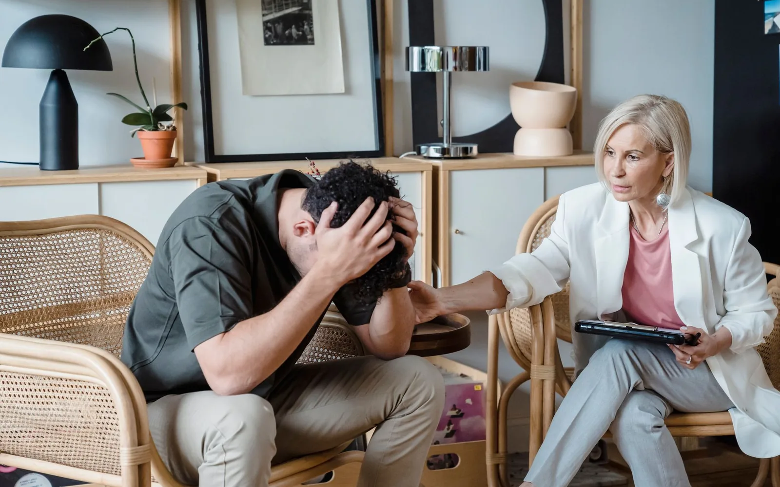 An adult receiving support for anxiety and depression during a private appointment