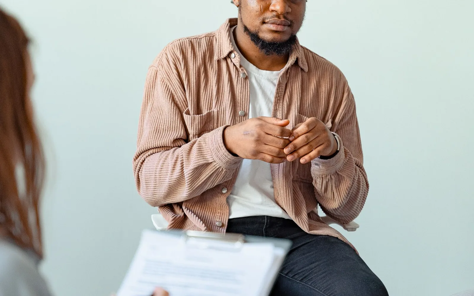 An adult exploring whether psychiatric care or therapy best fits his needs